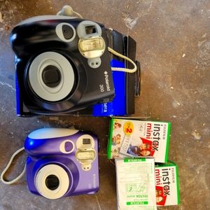 2 Polaroid cameras and film
